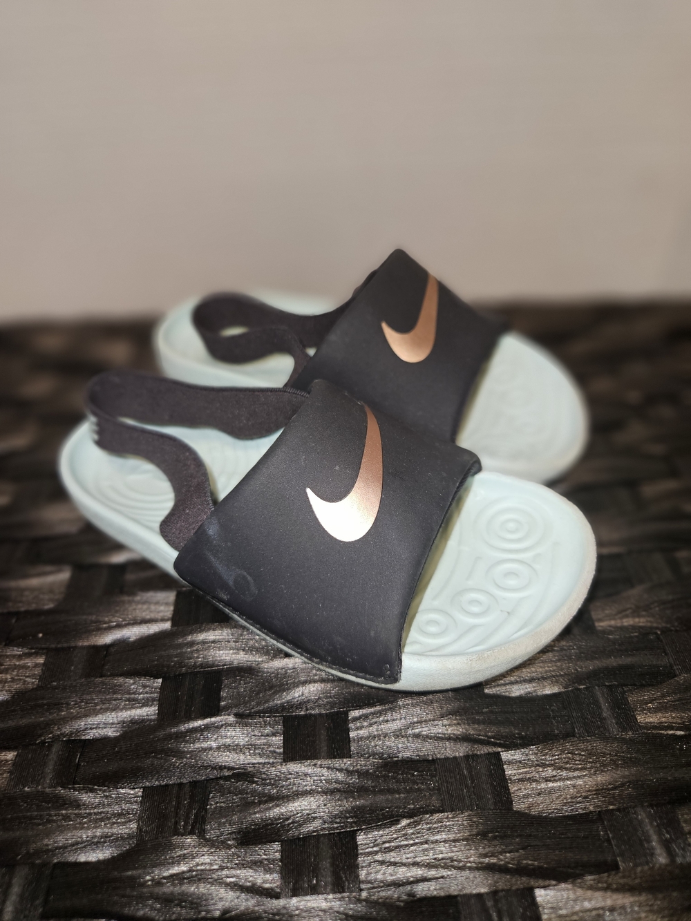Nike Kids Black Slides with Rose Gold Swoosh and Light Blue Footbed